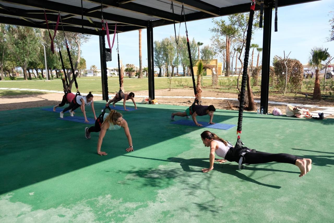 Lara Barut Collection Hotel Antália Exterior foto A group of women doing yoga at the park